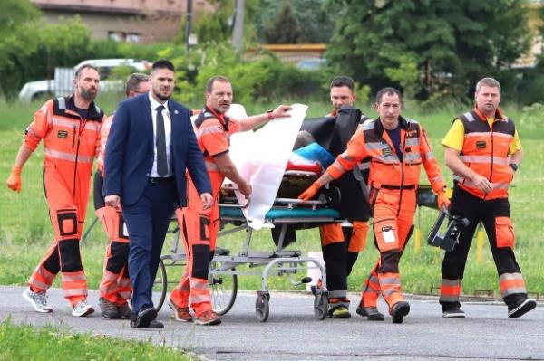 Rescue workers wheel Slovak Prime Minister Robert Fico, who was shot and injured, to a hospital in the town of Banska Bystrica, central Slovakia, Wednesday, May 15, 2024. (Jan Kroslak/TASR via AP)