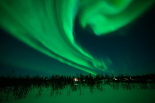 The Aurora Borealis, commo<em></em>nly known as the Northern Lights, are seen in the sky above Kiruna on March 7, 2024 in Kiruna, Sweden.