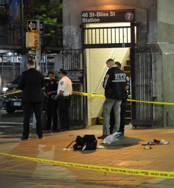 Police on the scene wher<em></em>e a person was stabbed on the street of the 46 St. Bliss Street station of the #7 train on Wednesday, May 8, 2024. (Sam Costanza for the New York Daily News)