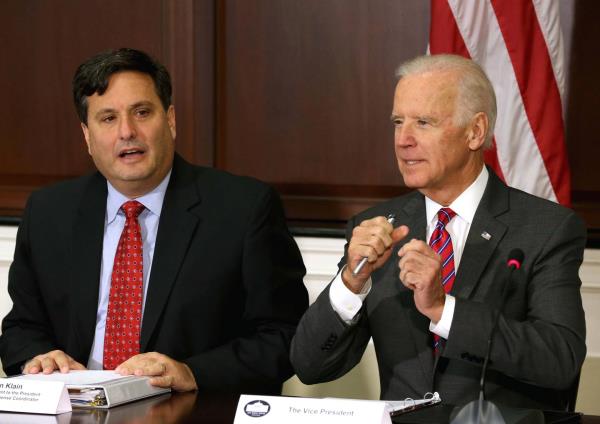 Ron Klain (left) sits with President Biden.