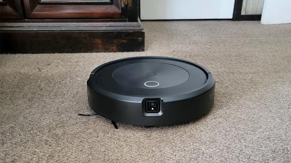 Robotic vacuum on beige carpet