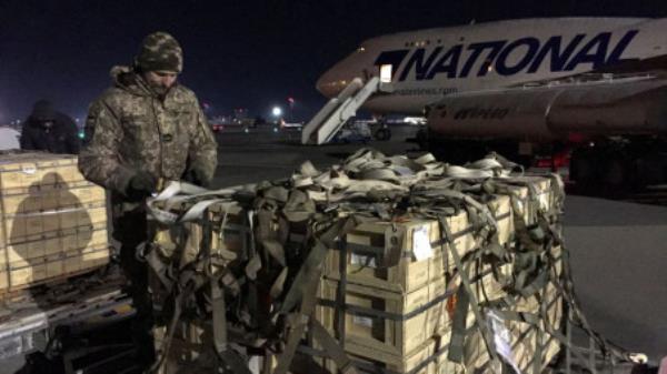 Military aid, delivered as part of the United States' security assistance to Ukraine, is unloaded from a plane at the Boryspil Internatio<em></em>nal Airport outside Kyiv, Ukraine February 13, 2022. REUTERS/Serhiy Takhmazov