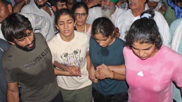 Indian wrestlers along with their supporters gather to immerse their medals in the river Ganges as a mark of protest against Brij Bhushan Singh, the wrestling federation chief, over allegations of sexual harassment and intimidation, in Haridwar on May 30, 2023. (Photo by AFP) (Photo by -/AFP via Getty Images)