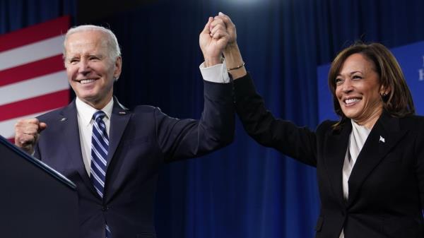 FILE - President Joe Biden and Vice President Kamala Harris stand on stage at the Democratic Natio<em></em>nal Committee winter meeting, Feb. 3, 2023, in Philadelphia. Harris is poised to play a critical role in next year's election as President Joe Biden seeks a second term. (AP Photo/Patrick Semansky, File)