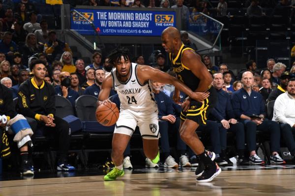 Cam Thomas #24 of the Brooklyn Nets drives to the basket during the game against the Golden State Warriors.