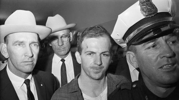 Lee Harvey Oswald with police