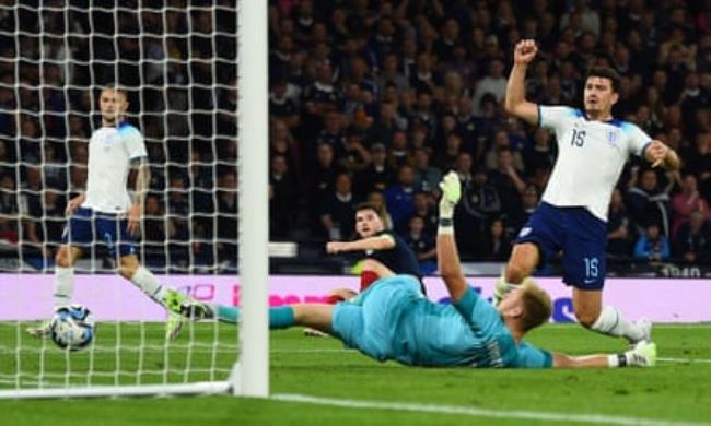 Harry Maguire reacts after scoring an own goal