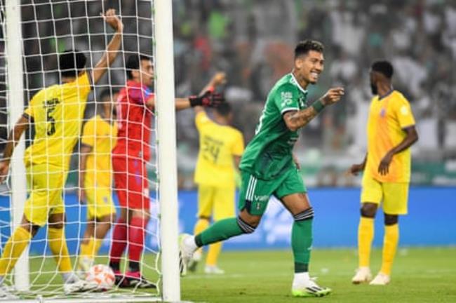 Roberto Firmino celebrates after scoring against Al-Hazm