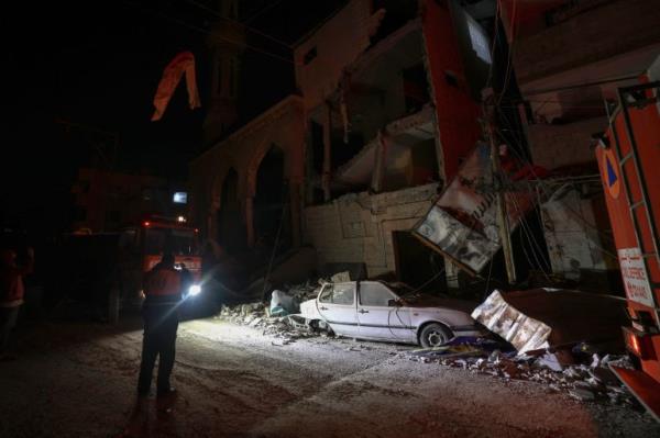 a car covered in debris at night