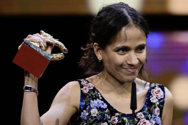 French-Senegalese filmmaker and actress Mati Diop celebrats with the Golden Bear for Best Film for the film 