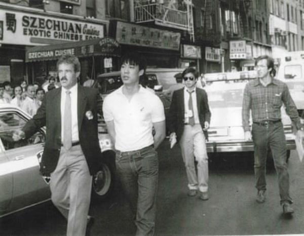 David Ng, wearing sunglasses, reporting at the scene of a shooting in lower Manhattan, circa 1985.