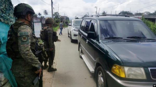 Troopers man a checkpoint near the site wher<em></em>e a bomb exploded in Marawi, southern Philippines, Dec. 3, 2023. 