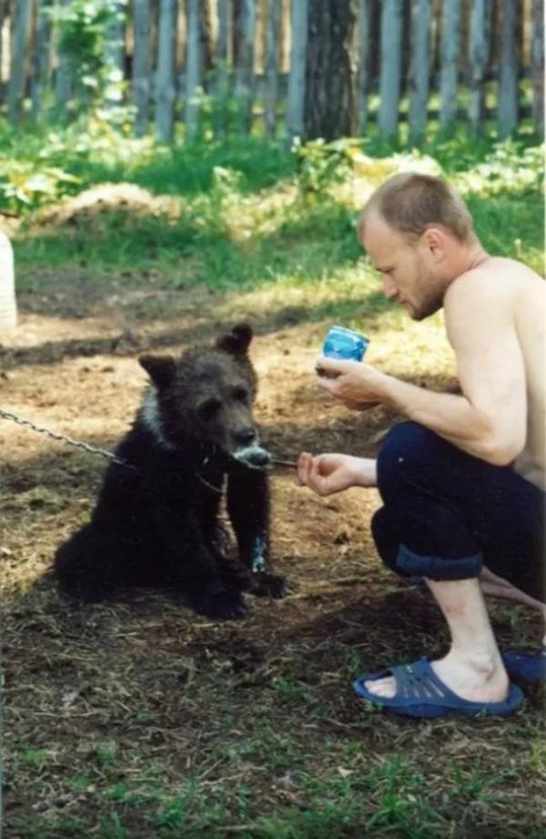 Hunter Sergey Grigoriyev adopted a bear cub in 2014. Credit: EAST2WEST