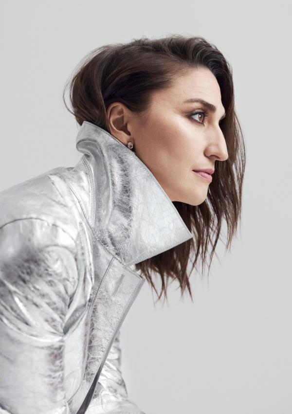 Sara Bareilles in Coat, $2,998 at Lafayette148NY.com; “Bubble” earrings with amethysts and pearls, $175 at Eye-M-IleanaMakri.com 