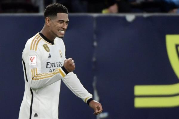 Real Madrid's English midfielder Jude Bellingham celebrates scoring his team's third goal during the Spanish league football match between Cadiz CF and Real Madrid CF at the Nuevo Mirandilla stadium in Cadiz on November 26, 2023.