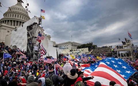 Trump supporters clash with police and security forces as people try to storm the US Capitol on January 6, 2021 in Washington, DC