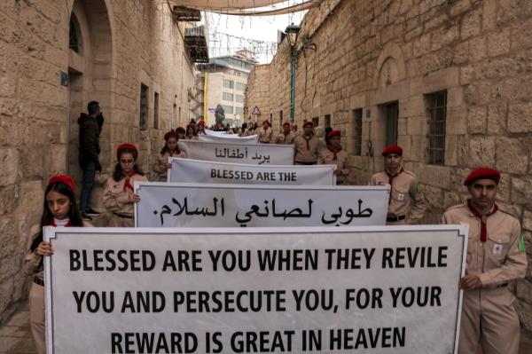 The scouts' march is part of the famous Procession of the Patriarch, which mimics the journey of Joseph and Mary from Jerusalem to Bethlehem.