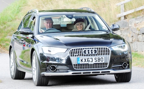 The King pictured driving his ￡80,000 electric Audi Q8 to Crathie Kirk near Balmoral for a Sunday service in August