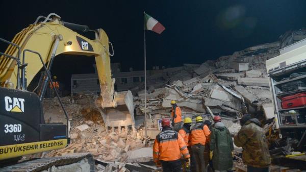 Residents and rescue perso<em></em>nnel search for victims and survivors through the rubble of the collapsed hotel in Adiyaman, in the night of 8 February 2023