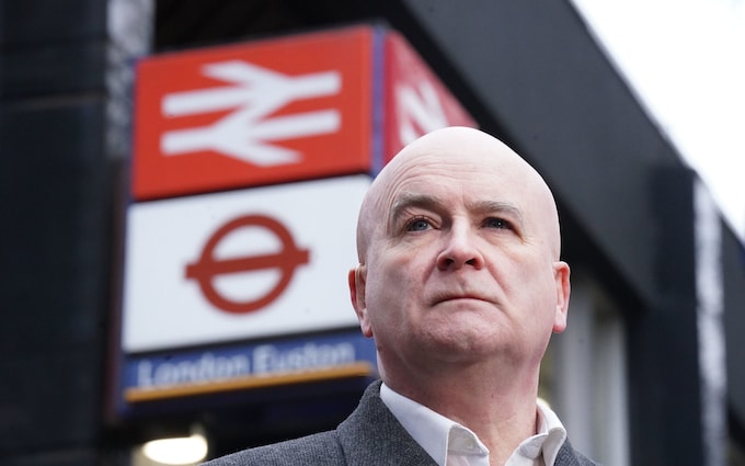 Mick Lynch, general secretary of the Rail, Maritime and Transport unio<em></em>n (RMT) on a picket line during a rail strike