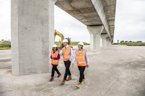 Deputy Premier Prue Car, left, Premier Chris Minns and Transport Minister Jo Haylen at the site of the Luddenham train station.