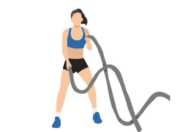 woman doing battle ropes