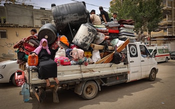 Palestinians pile their belo<em></em>ngings on a vehicle as it drives to safer areas in Rafah, in the southern Gaza Strip, on May 10, 2024