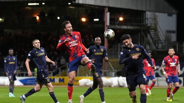 Rangers' Ben Davies and Dundee's Ricki Lamie battle for possession