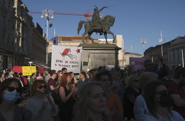 FILE - People attend a protest in solidarity with a woman who was denied an abortion despite her fetus havin<em></em>g serious health problems, in Zagreb, Croatia, on May 12, 2022. In staunchly Catholic Croatia, influential co<em></em>nservative and religious groups have tried to get abortion banned but with no success. However, many doctors refuse to terminate pregnancies, forcing Croatian women to travel to neighboring countries for the procedure. (AP Photo, File)