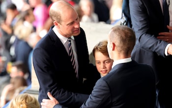 Prince William and Prince George arrive to take their seats at the Olympiastadion in Berlin