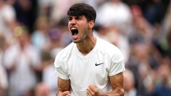 Alcaraz celebrates winning match point against Frances Tiafoe