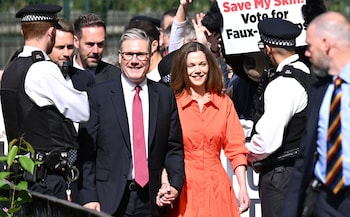 Sir Keir Starmer and his wife Victoria walking hand-in-hand