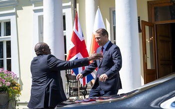 David Lammy exuberantly greets Polish Foreign Minister Radoslaw Sikorski