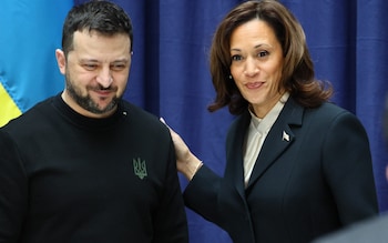 Ukrainian President Volodymyr Zelensky and US Vice President Kamala Harris smile at the end of a press co<em></em>nference at the Munich Security Conference