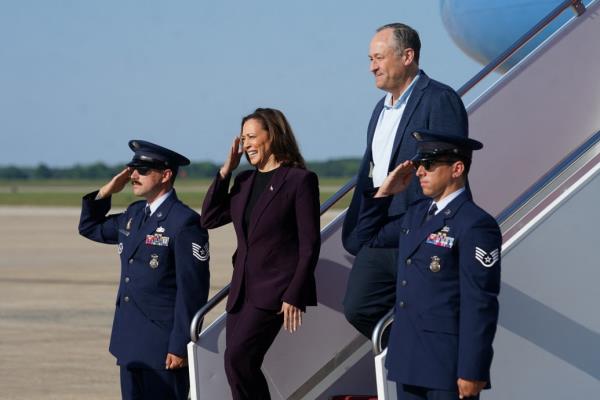 Democratic presidential nominee and U.S. Vice President Kamala Harris and second gentleman Doug Emhoff step from Air Force Two as they arrive at Joint ba<em></em>se Andrews, Maryland, U.S., August 23, 2024.  