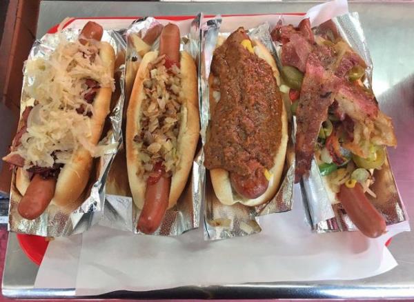 An array of hot dogs with various toppings at Pink's restaurant