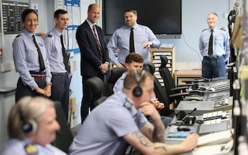 Prince William meets perso<em></em>nnel in the co<em></em>ntrol tower at RAF Valley