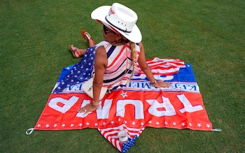 A Trump voter shows her support at his rally in Miami last week