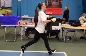 Runners carrying ballot boxes were frequently shifting focus in the back of camera f<em></em>rames