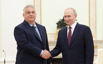 Vladimir Putin shakes hands with Hungary's Prime Minister Viktor Orban during a meeting at the Kremlin in Moscow