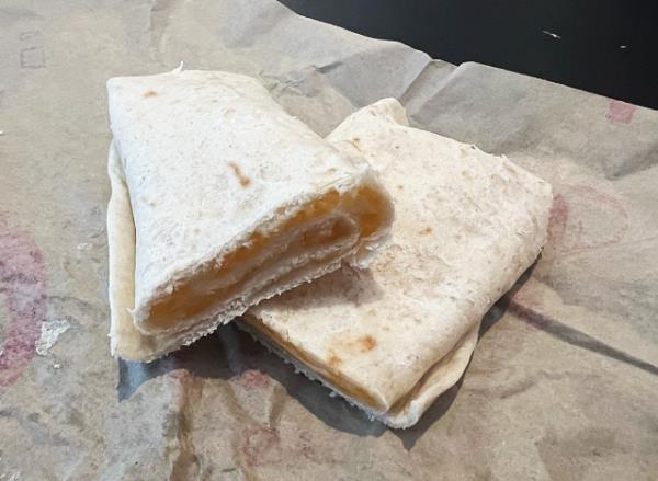 taco bell cheesy roll up cut in half 