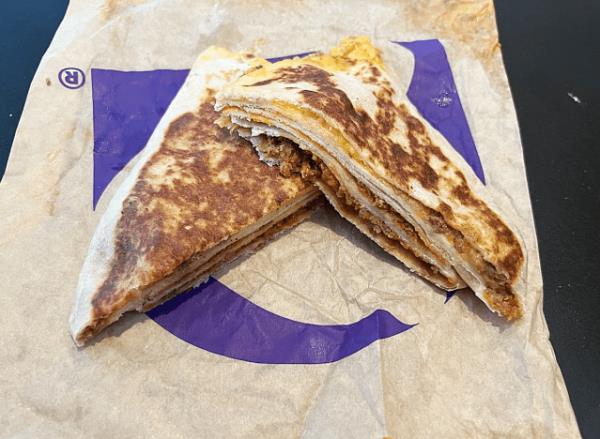 a stacker from taco bell cut in half 