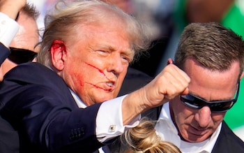 Former president Do<em></em>nald Trump reacts following an assassination attempt at a campaign event