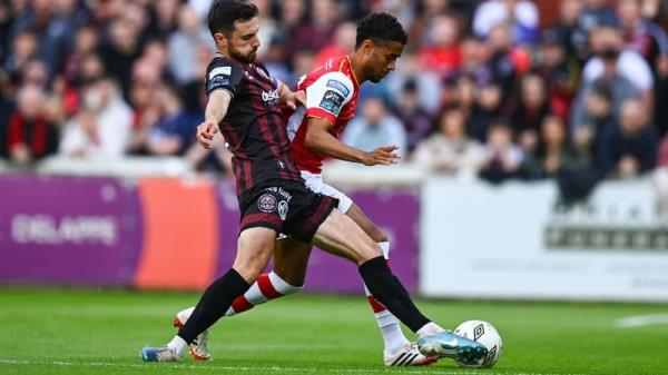 Romal Palmer of St Patrick's Athletic is tackled by Jordan Flores of Bohemians