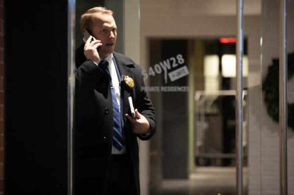 Police officer in the lobby of building