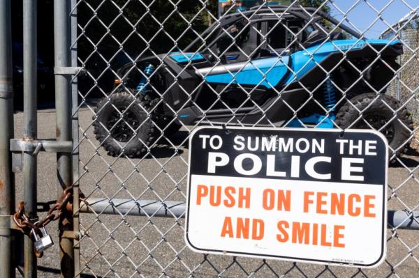 Sign outside dealership warning would-be thieves