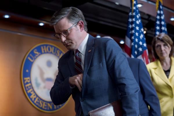 Speaker of the House Mike Johnson, in suit and tie, departing the Capitol in Washington after discussing Republican respo<em></em>nses to student protests