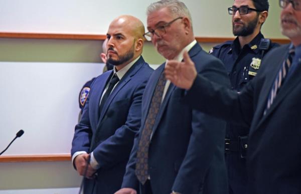 1/23/24  NYPD officer Eric Duran (pictured, with beard) was arraigned in Bronx Criminal Court for murder.  He is accused of throwing a full beverage cooler at a man named Eric Duprey, who was trying to flee from the officer during a drug bust on Aqueduct Avenue near West 190th Street. 