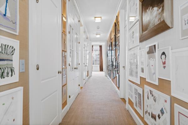 Interior of an art-filled hallway. 