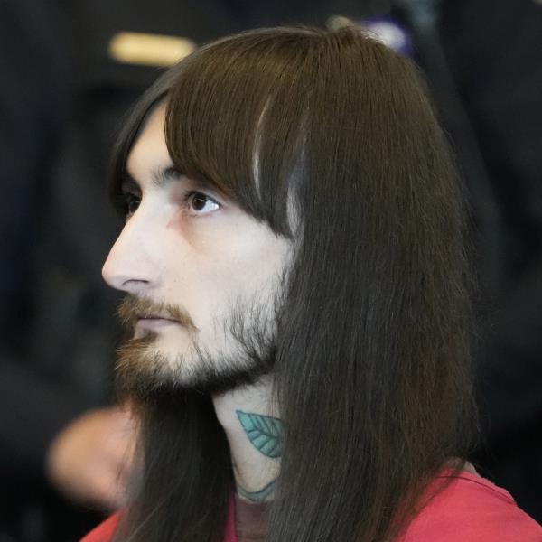 Bobby Crimo III appeared in court Monday, handcuffed with long hair in a red prison uniform